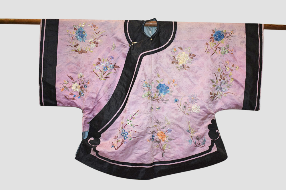 Chinese pale mauve silk damask jacket, early 20th century, embroidered in coloured silks with