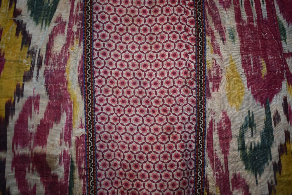 Uzbek silk ikat chapan, Uzbekistan, early 20th century, lined with printed cotton. With wear and - Image 7 of 11
