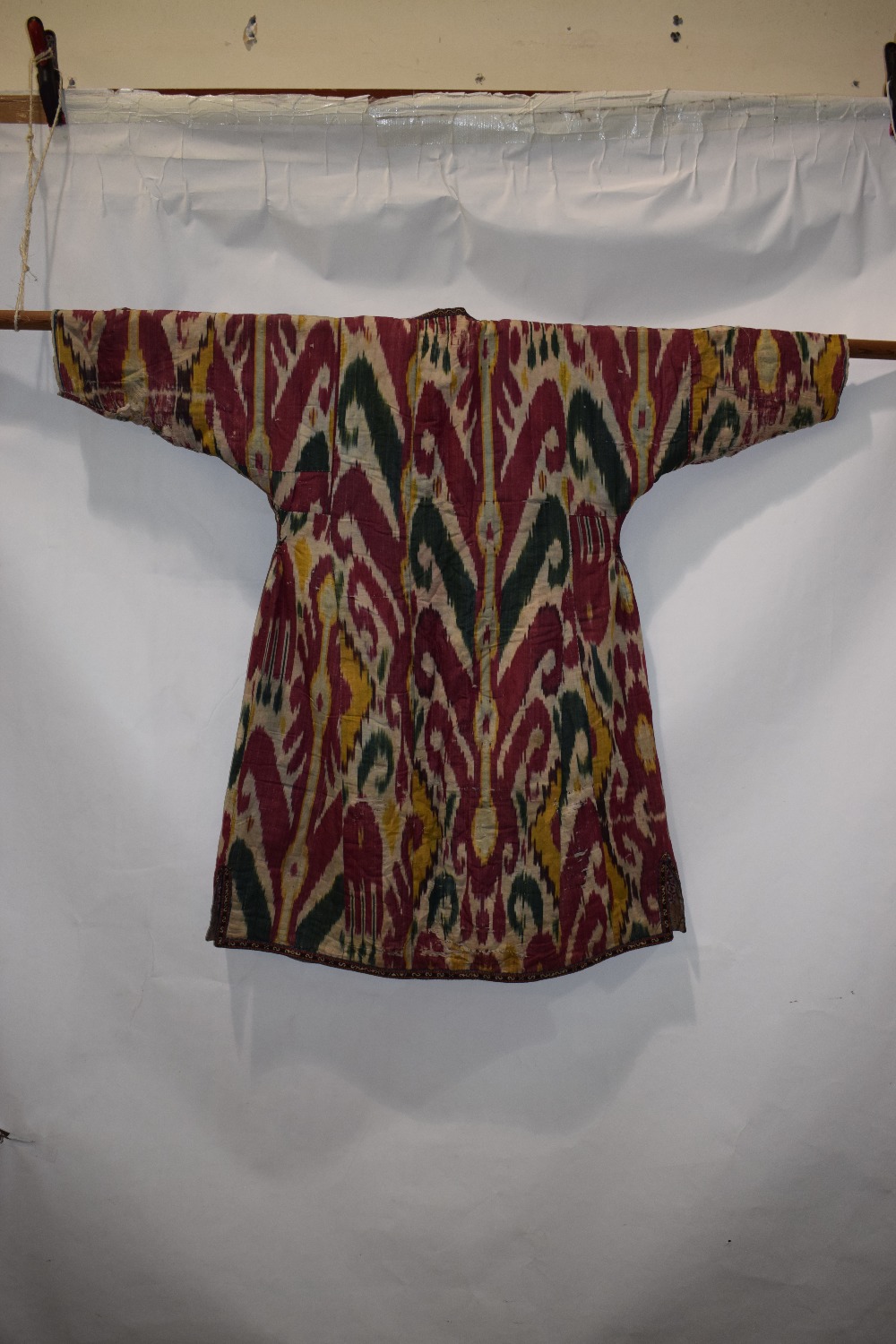Uzbek silk ikat chapan, Uzbekistan, early 20th century, lined with printed cotton. With wear and - Image 11 of 11