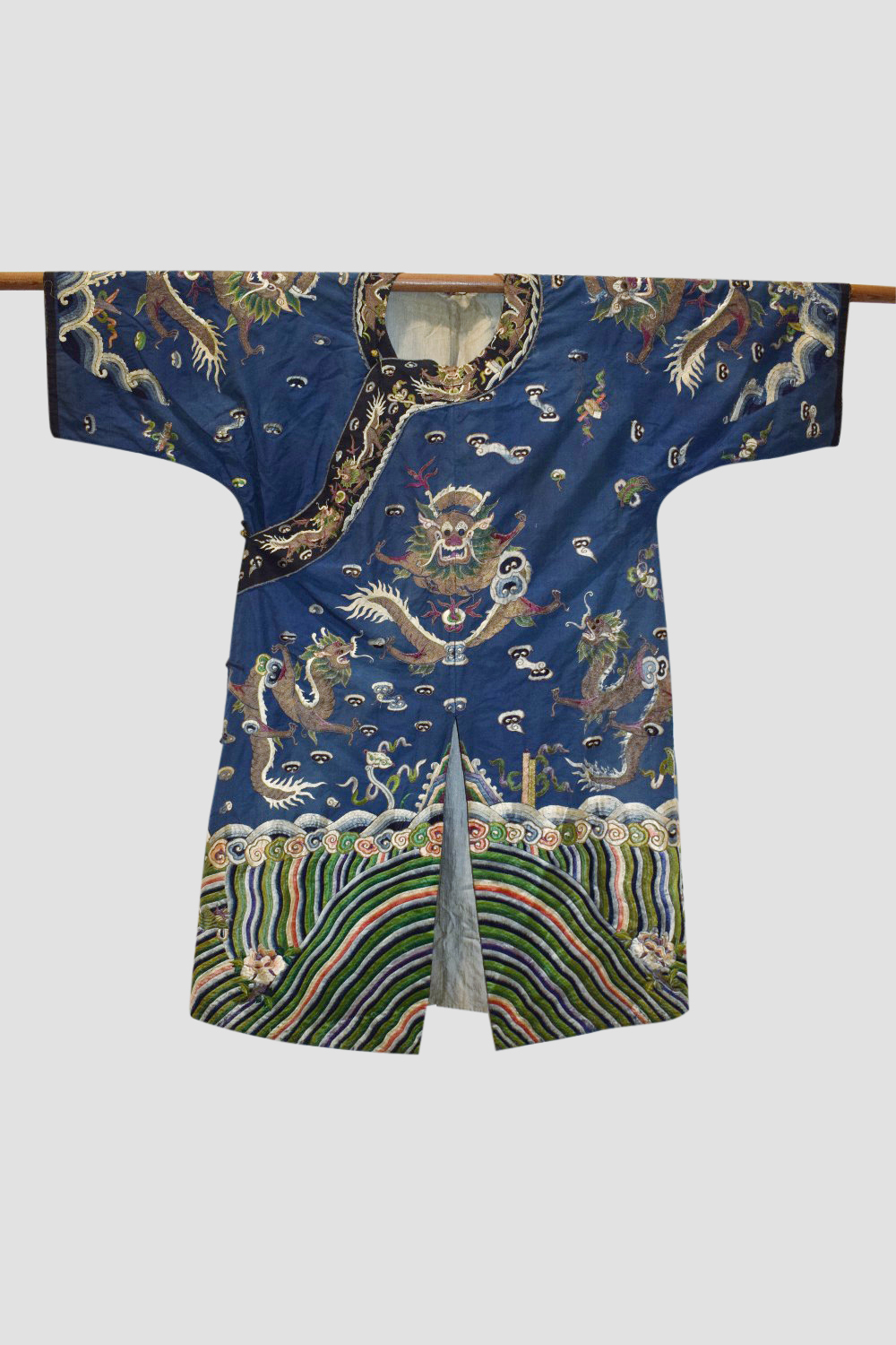 Fine Chinese blue silk dragon robe, late 19th/early 20th century, the four-clawed dragons above a