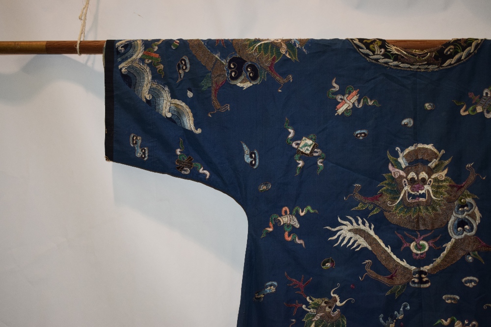 Fine Chinese blue silk dragon robe, late 19th/early 20th century, the four-clawed dragons above a - Image 14 of 17