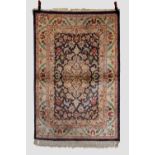 Indian silk rug, modern, 6ft. X 4ft. 1.83m. X 1.22m. Dark blue field with ivory centre medallion and