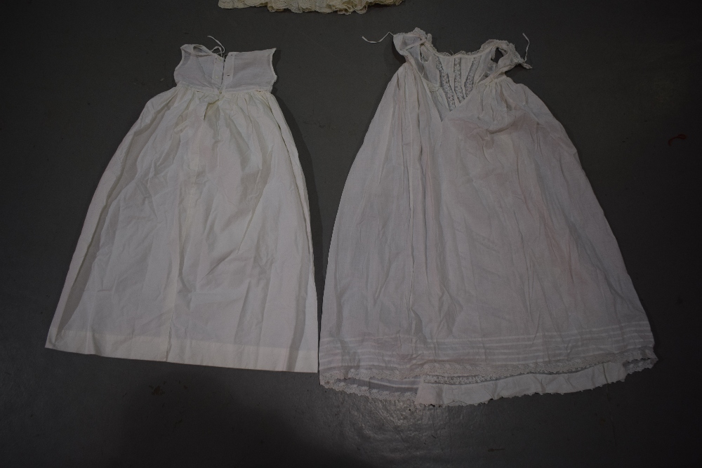 Two fine white cotton christening gowns, one with white embroidered panelled skirt; the other with - Image 5 of 8
