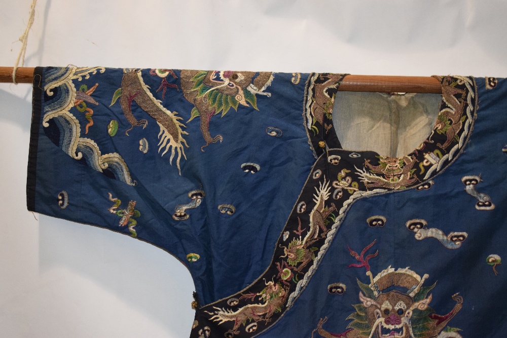 Fine Chinese blue silk dragon robe, late 19th/early 20th century, the four-clawed dragons above a - Image 5 of 17