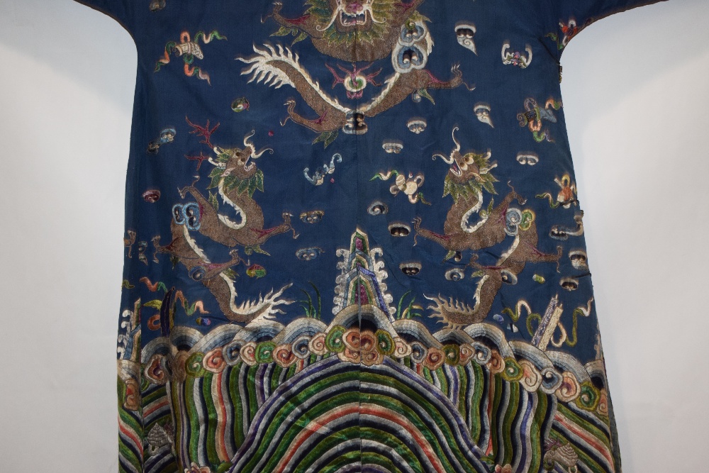 Fine Chinese blue silk dragon robe, late 19th/early 20th century, the four-clawed dragons above a - Image 16 of 17