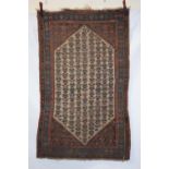 Kurdish rug, north west Persia, circa 1920s-30s,. 6ft. 1in. X 3ft. 8in. 1.86m. X 1.12m. Overall wear
