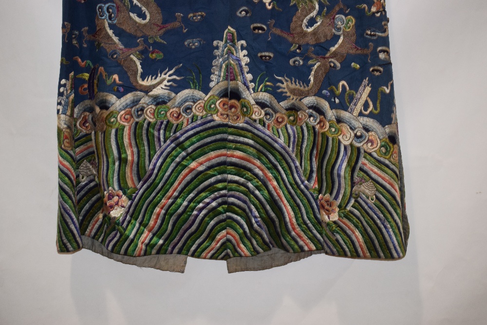 Fine Chinese blue silk dragon robe, late 19th/early 20th century, the four-clawed dragons above a - Image 17 of 17