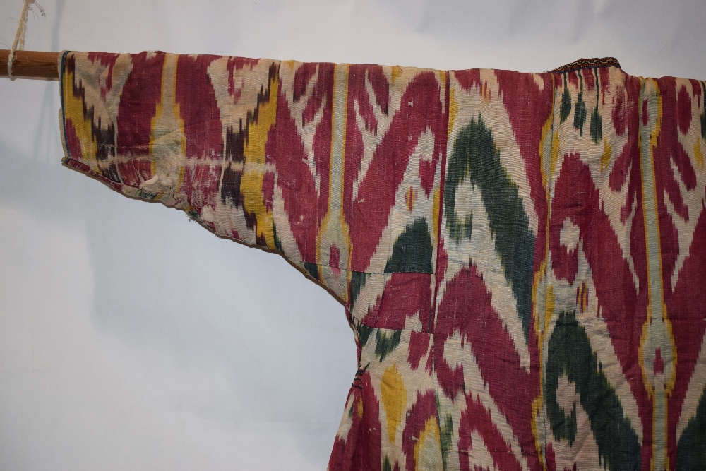 Uzbek silk ikat chapan, Uzbekistan, early 20th century, lined with printed cotton. With wear and - Image 8 of 11