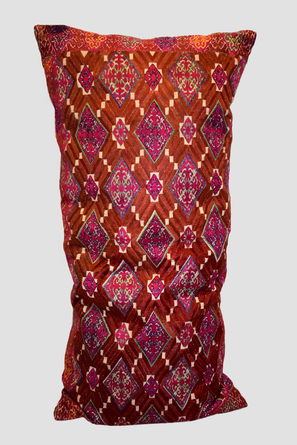 Swat Valley floss silk embroidered bolster, Pakistan, second half 20th century, 32in. X 16in.
