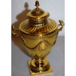 An Edwardian silver gilt copy of an Adam tea vase with Neo classical swags, acanthus and fluting,