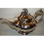 A William IV silver teapot, everted melon panelled, with a swan neck, spout, the hinged lid with a