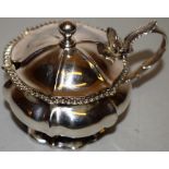 An early Victorian silver mustard pot, everted melon panelled, the hinged lid with a globe finial, a