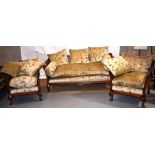 A mid twentieth century walnut bergere sitting room suite, with caned backs and sides, sprung