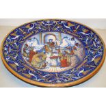 An Italian Majolica charger, decorated coloured classical scenes, of homage to an emperor with an