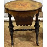 A Victorian walnut work table, the oval lidded top veneered in burr figured walnut, revealing a