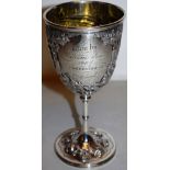 A Victorian silver target shooting militaria prize goblet, the bowl with repousse figures of