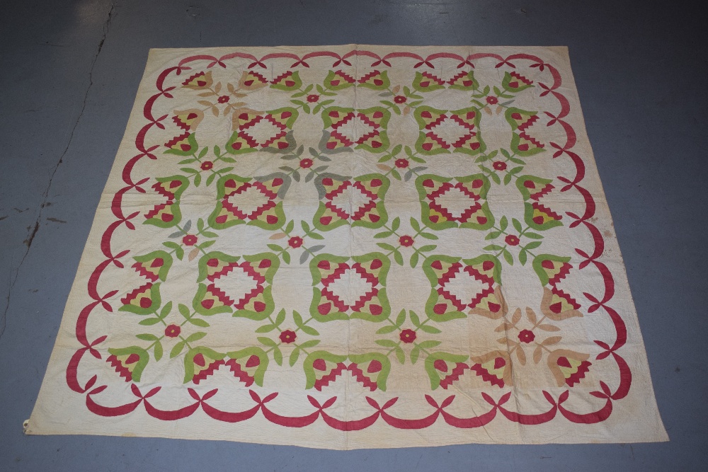 Attractive American applique quilt, mid-19th century, 84in., 213cm. sq. Unlined. Some time spots/