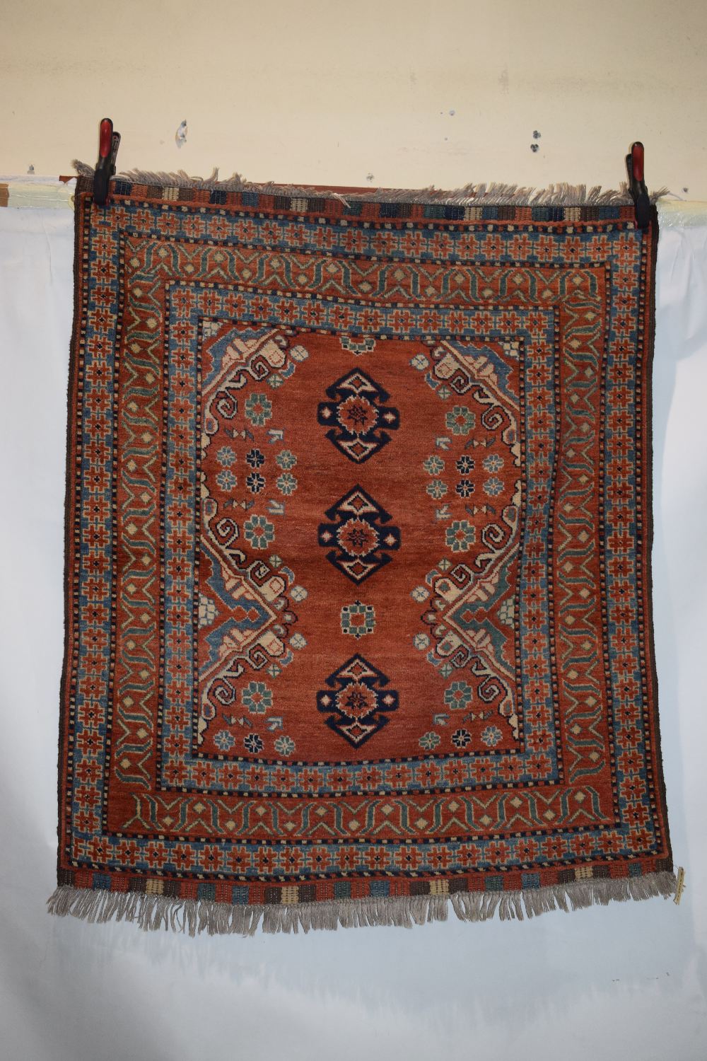 Afghan rug of Caucasian design, modern production, 4ft. 6in. x 3ft. 10in. 1.37m. x 1.17m.