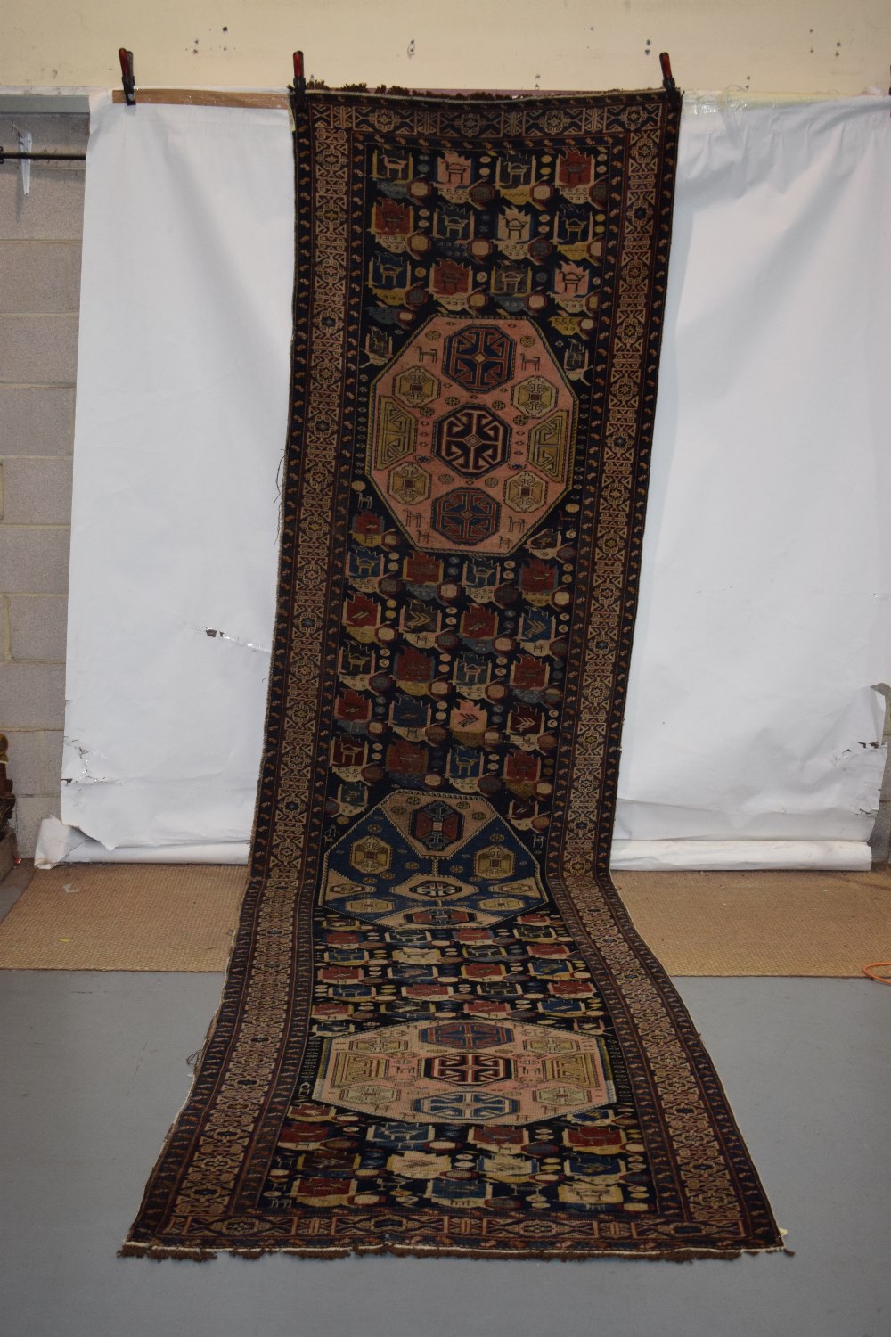 Caucasian runner with Kufic main border, Daghestan district, late 19th century, 16ft. 2in. x 3ft.