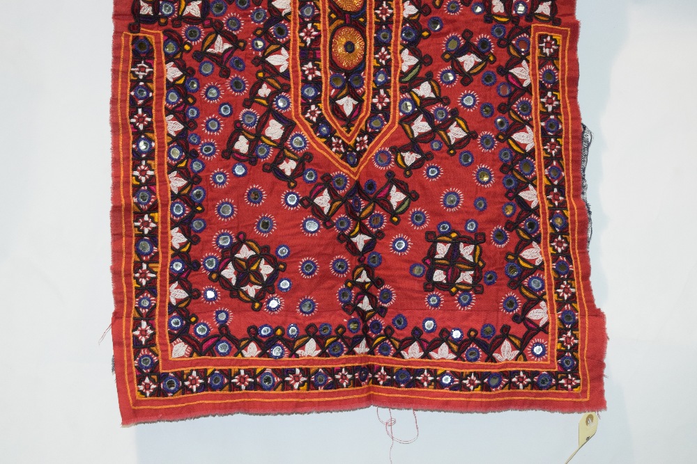 Two Indian textiles, Kutch, west India, the first a red cotton dress front, embroidered with flowers - Image 3 of 8