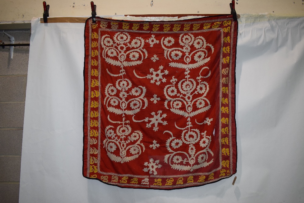 Samarkand red ground suzani, Uzbekistan, first half 20th century, 52in. x 49in. 132cm. x 124cm. Some