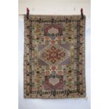 Two rugs: the first an Anatolian rug, circa 1950s, 4ft. 7in. x 3ft. 5in. 1.40m. x 1.04m., the second
