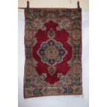 Two Kerman rugs, south east Persia, circa 1940s-50s, the first a prayer rug, 5ft. x 3ft. 3in. 1.52m.
