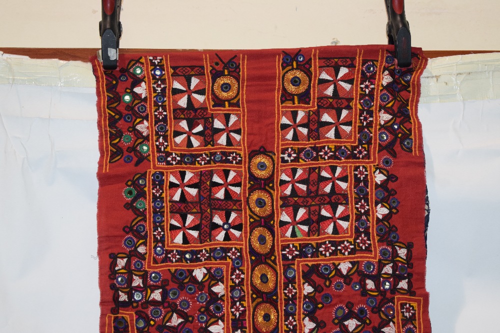 Two Indian textiles, Kutch, west India, the first a red cotton dress front, embroidered with flowers - Image 2 of 8