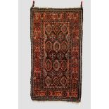 Two rugs, the first: Salar Khani Baluchi rug, north east Persia, circa 1920s-30s, 6ft. 7in. x 3ft.