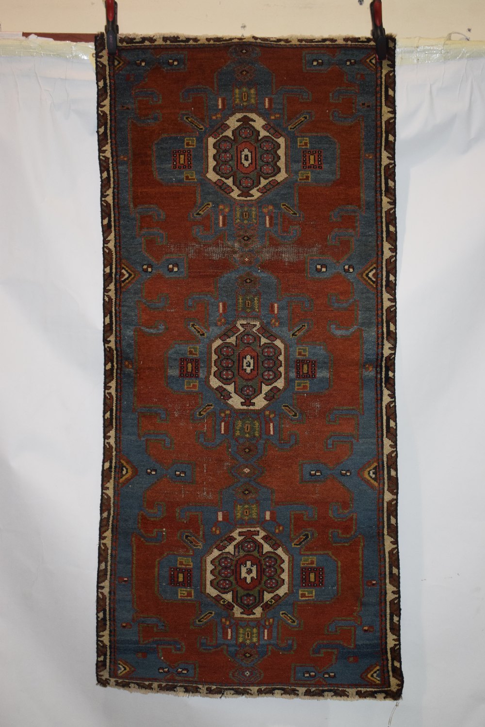 North west Persian rug fragment, circa 1930s, 6ft. 2in. x 2ft. 9in. 1.88m. x 0.84m. Reduced on all