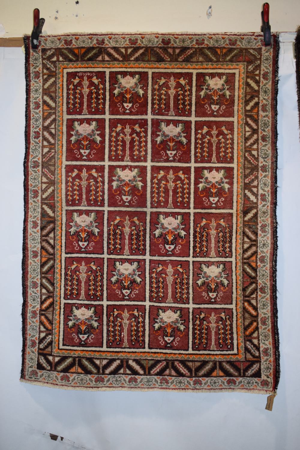 Two Persian rugs, the first: Fars, south west Persia, circa 1940s, 4ft. x 2ft. 10in. 1.22m. x 0.86m.