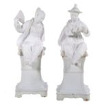 Pair of White-Glazed Terracotta Mandarin Figures