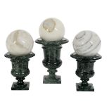 Three Marble Urns with Carpet Boules