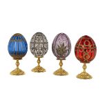 Four Engraved and Cut Crystal Eggs on Stands