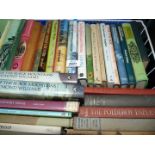 A white basket of Hardback novels to include The Polderoy Papers, People of The Black Mountains etc.