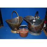 A large Copper coal Scuttle, brass coal scuttle and a copper Kettle.