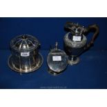 A silver plated Biscuit Barrel, sugar scuttle and spoon,