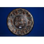 A Copper and inlaid white metal Charger with Egyptian figures, profiles, boats, etc.