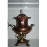 A copper Samovar, hot water/ tea, coffee server with milk glass handles and brass tap.