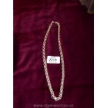 A heavy silver coloured rope twist necklace,