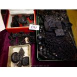 A quantity of black bead Necklaces, some loose and brooches, some jet, some in a Tudor styled box.