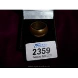 *****An 18k marked wide wedding band.