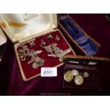 A quantity of marcasite Brooches and earrings together with icons and a watch box.