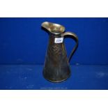 A Liberty style brass jug, 10 3/4" tall.