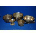 Two brass bowls to include one with oriental style decoration, a small cooking pot,