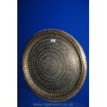 A large pierced brass wall plaque of Moorish design, 23 1/2" diameter.