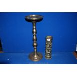 A Brass stand 20" tall and Shell case, decorated.