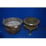 A brass circular based Cooking Pot and a small double Trivet.