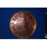 A large copper pie crust edge Charger, 33" diameter.
