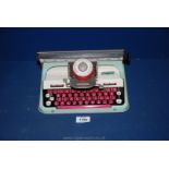 A Mettoy tin plate typewriter.